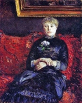 Женщина на красном диване