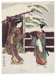 Молодая пара у ворот в снегу
