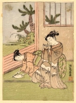 Две молодых женщины складывают бумажных журавликов