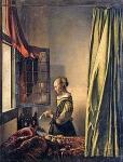Girl reading a letter by an open window